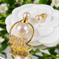 Luxury Gold-Tone Pearl Hoop Earrings with Sparkling Crystal Logo – Elegant Statement Jewelry